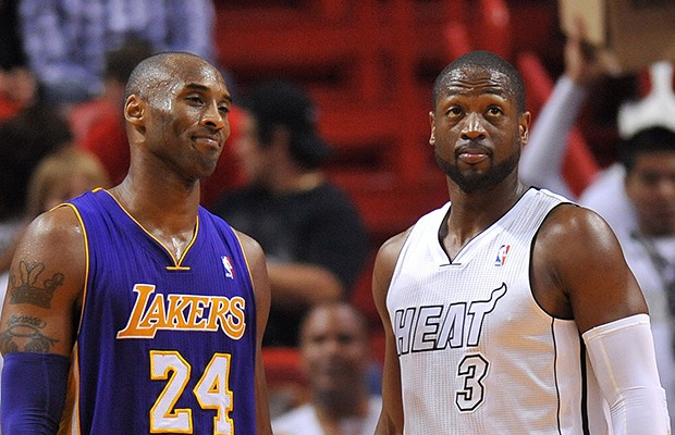 Feb 10, 2013; Miami, FL, USA; Los Angeles Lakers shooting guard Kobe Bryant (24) and Miami Heat shooting guard Dwyane Wade (3) during the second half at American Airlines Arena. Miami won 107-97. Mandatory Credit: Steve Mitchell-USA TODAY Sports